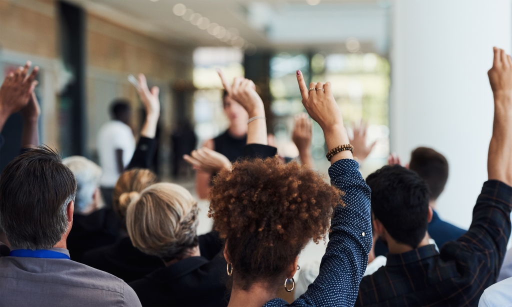 A room with hands raised
